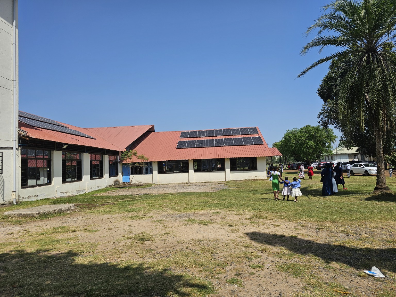 Solar panels installed across the roofs of an institutional facility